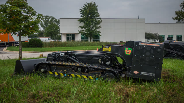 Pocket Bucket, a tracked dirt mover, in blade configuration.